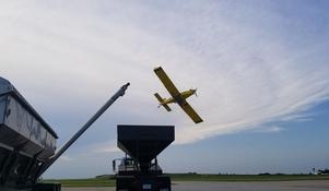 Yellow Agricultural Aircraft Flying in the Sky
